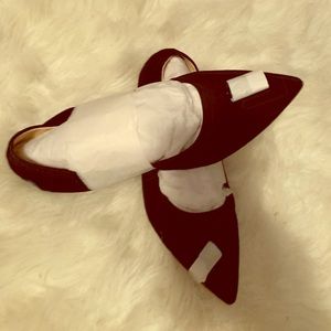 Black suede tassel flats